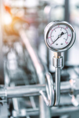 Pressure gauges mounted on the pipeline.