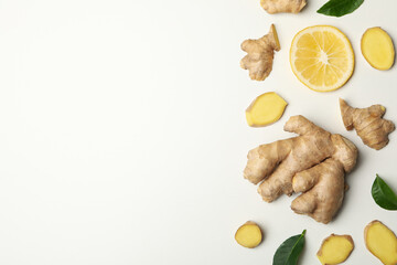 Fresh ginger and lemon on white background, top view