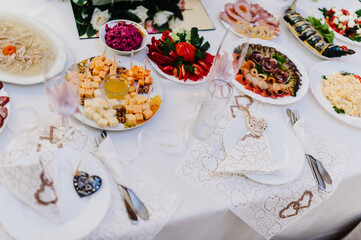 A table with cutlery, food, wine for people to celebrate. Concept of dining lunch. Business Lunch Concept. flat lay. top view.
