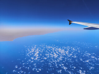 Fototapeta premium view to the blue sea with clouds and horizon