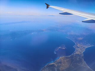 view to the coast and blue sea during a flight