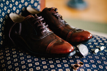 Close Up of elegant stylish male accessories. Side view of cufflinks, rings, watch, shoes....