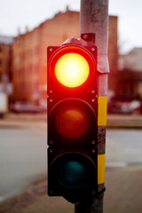 Traffic light red on a city street.
