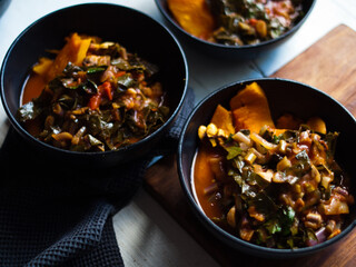 Roast pumpkin Italian ragout in bowl and roasting dish. Low carb. Home made. Natural light