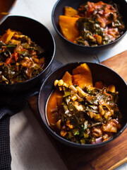 Roast pumpkin Italian ragout in bowl and roasting dish. Low carb. Home made. Natural light