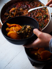 Roast pumpkin Italian ragout in bowl and roasting dish. Low carb. Home made. Natural light