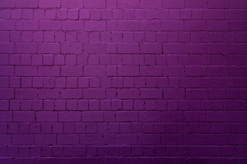 Purple brick wall background with shades of light and dark purple