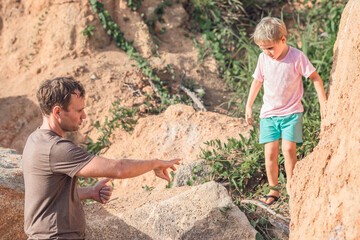 Dad son walk summer park, daddy show teach explain safety measures climbing methods dangerous...