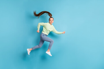 Full length body size side profile photo of jumping funny female runner with long hair ponytail...