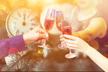 Two glasses of champagne with lights in the background. christmas background