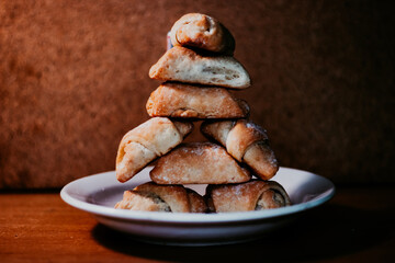 bagel cookies laid out in the form of a man on a white plate