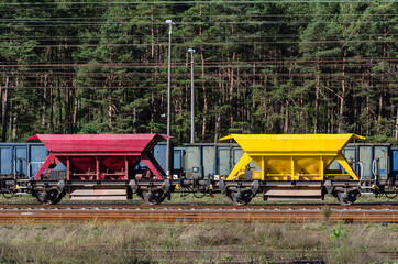 WAGONS WITH CRUSHED STONE - Color railway on the sidetrack

