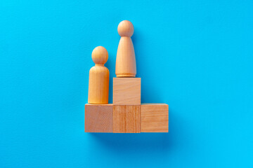 Top view of wooden toy blocks on blue