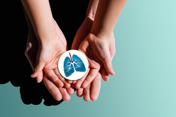Adult and child hands holding lung, world tuberculosis day, world no tobacco day, lung cancer, coronavirus covid-19, Pulmonary hypertension, Pneumonia, copd, eco air pollution,organ donation concept