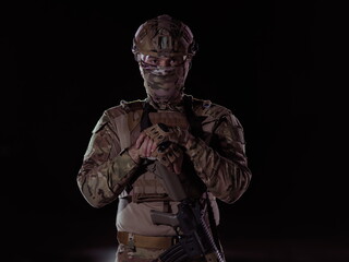 Fototapeta na wymiar soldier with full combat gear in night mission