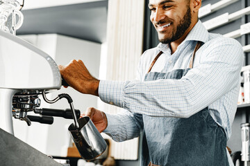 African american man barista preparing coffee on professional coffee machine