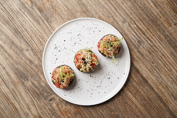 Salmon tartare with guacamole sauce, close-up