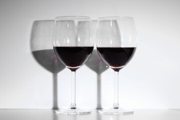 two red wineglass isolate on white background with copy space for your text