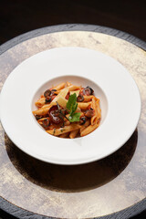 Pasta Penne with Tomato, olives and Basil