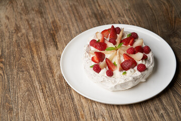 Strawberry cake with fresh strawberries on white plate