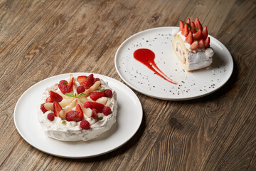 Strawberry cake with fresh strawberries on white plate