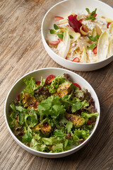 Endive salad with goat cheese, strawberry and walnuts.