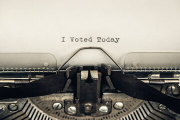 typing motivational slogan I voted today on a vintage typewriter close-up