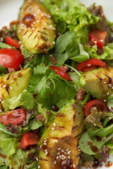 Avocado salad with fresh leaves and vegetable