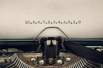typing countdown from ten to zero on a vintage typewriter close-up