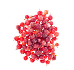 Heap of red gooseberry berries isolated on white background.