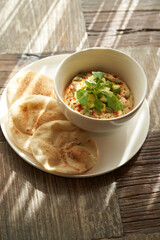 Hummus with avocado and herbs