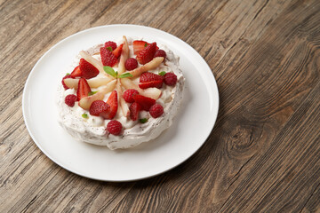 Strawberry cake with fresh strawberries on white plate