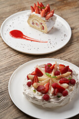 Strawberry cake with fresh strawberries on white plate