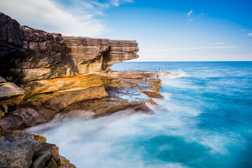 Fishing against the strong wave in Kamay Botany Bay National Park of Australia