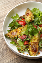 Avocado salad with fresh leaves and vegetable