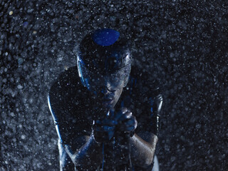 triathlon athlete riding bike on rainy night