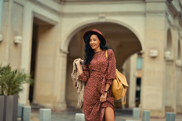 Young woman walking happily on the streets of Bucharest