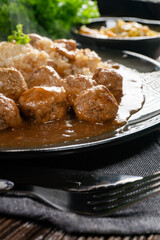 Minced meat balls in mushroom sauce.
