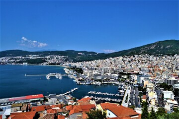 Fototapeta na wymiar Kavala City and view from Ottoman Castle. Ancient Ottoman City in Greece: Kavala. Panoramic views of the aegean sea and vintage buildings. 