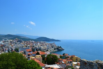 Fototapeta premium Kavala City and view from Ottoman Castle. Ancient Ottoman City in Greece: Kavala. Panoramic views of the aegean sea and vintage buildings. 