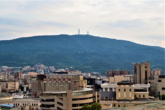 Skopje city view from Ottoman Castle..Skopje buildings in city Center and huge cross in Vodno Mountain