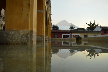 Obraz premium Sunrise over the stunning volcanoes and Lake Atitlan in Guatemala, Central America