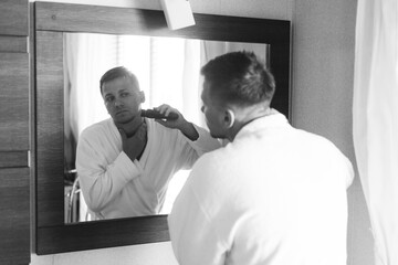 Obraz premium Gathering of the stylish groom at the hotel in the apartment