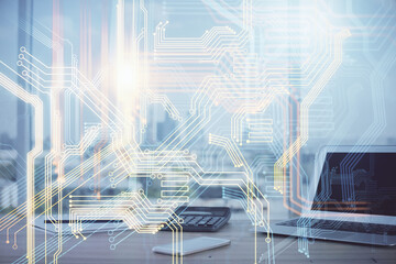 Double exposure of desktop with computer and world map hologram. International data network concept.