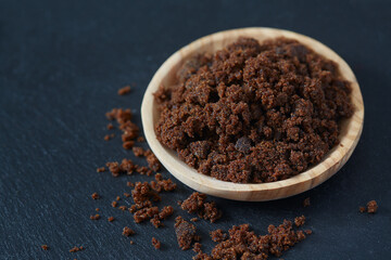 molasses sugar on wooden surface