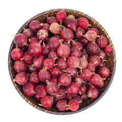 Organic berries, gooseberries in wooden bowl. Photo