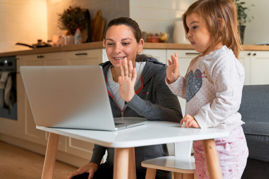 Mother and child at home. Video chat. Family doctor online. Social distance. Distance learning, home learning.