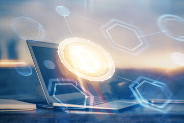 Double exposure of blockchain theme hologram and table with computer background. Concept of bitcoin crypto currency.