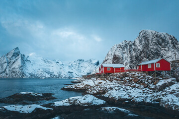 Famous Norwegian cabins covered by snow in Hamnøy in Lofoten.