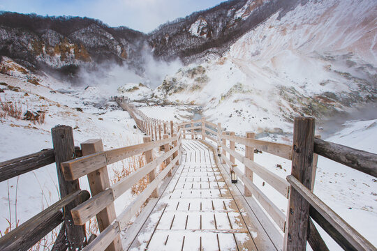 Wooden path of Jigokudani or hell valley in Noboribetsu, Hokkaido, Japan In winter.